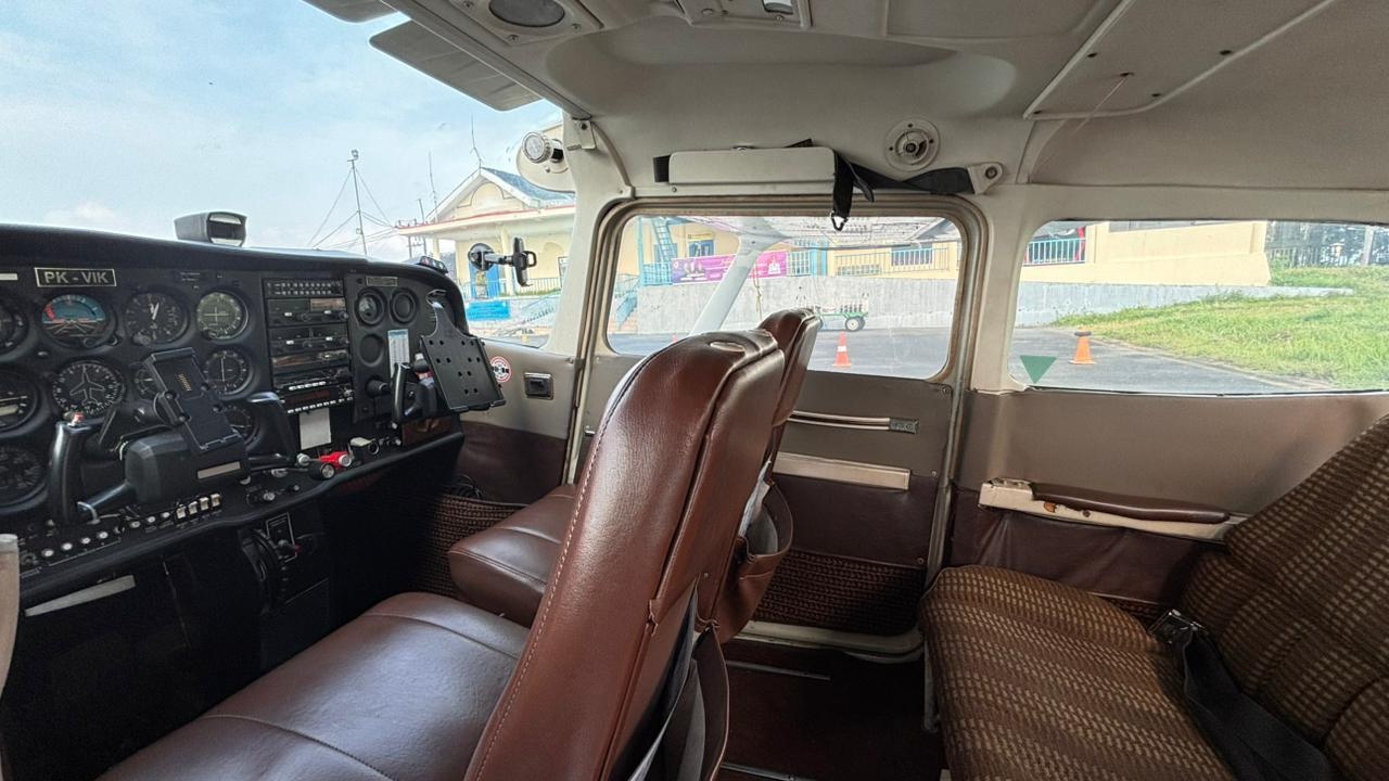 Cessna 172 cabin interior with seats and controls